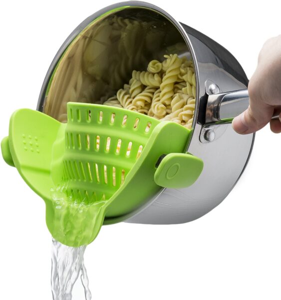 Noodles being strain by the Kitchen Gizmo Snap N Strain Strainer