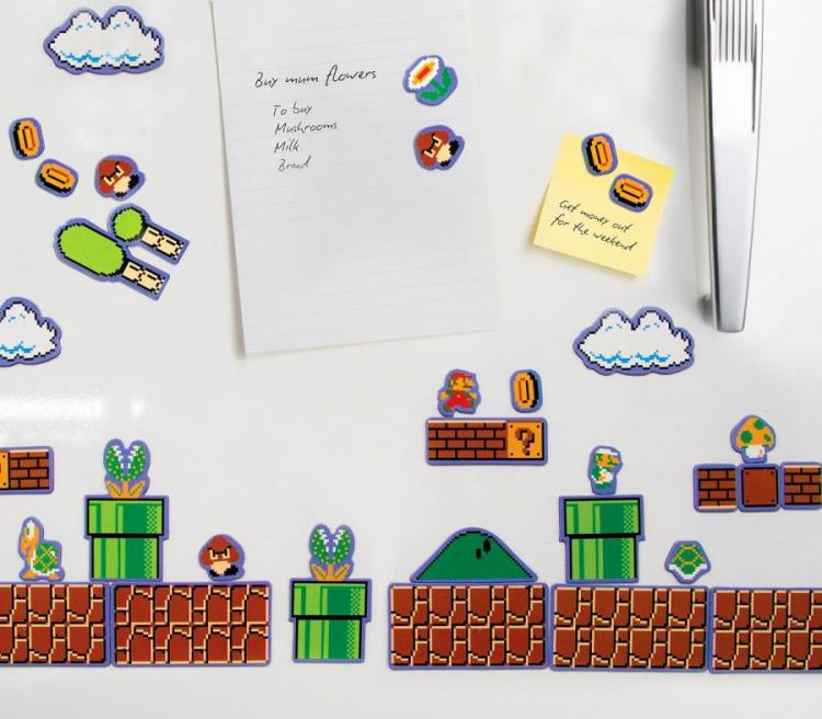 Mario themed stickers including Mario game base, clouds, coins, and brick on a white fridge with a silver handle
