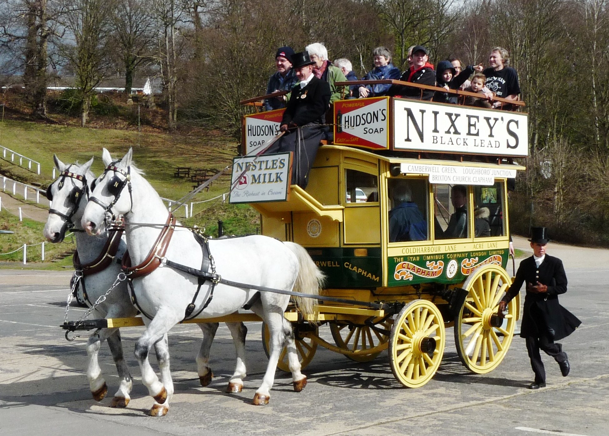 People riding on a Nixey's horse bus