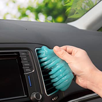 A hand using Car cleaning gel