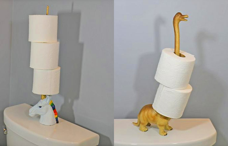 A white unicorn and skin-brown toilet paper holder on a white commode