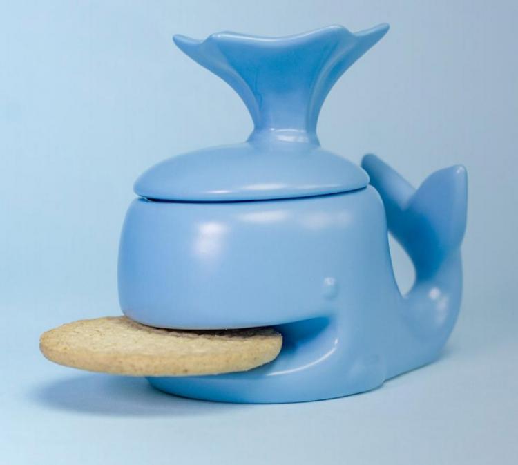 Blue colored whale-shaped mug with a cookie