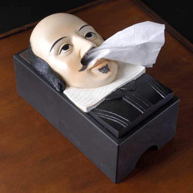 Black Shakespeare themed box on a dark brown wooden box 