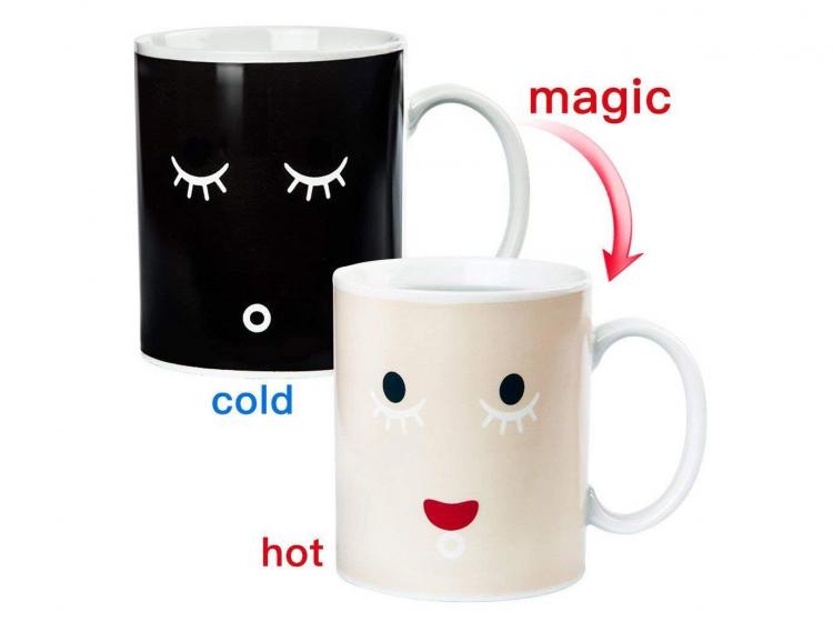 A black mug with imprinted closed sleepy eyes and white mug with imprinted open and smiley eyes