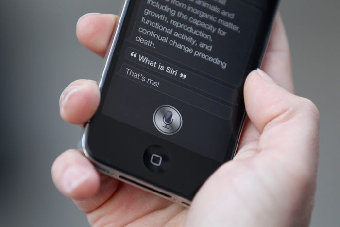 IPhone 4S on someone's hand while using Siri