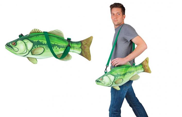A grey shirt and jeans wearing man carrying a green fish cooler ag