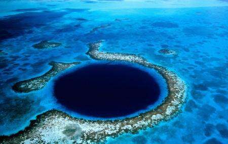 Dark blue colored Great blue hole of Belize drone shot