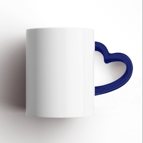 White-colored heart handle coffee mug with navy blue handle