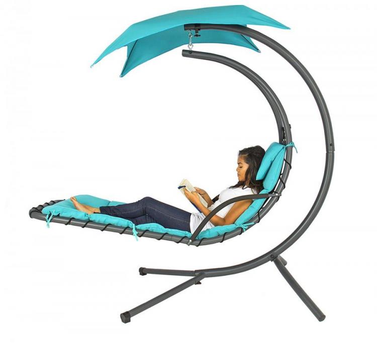 A girl, wearing a white shirt and jeans, resting on light blue Outdoor Hanging Chaise Lounger Hammock