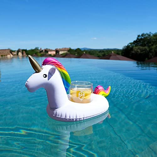 A white unicorn with rainbow-colored hair holding a lemon drink in pool
