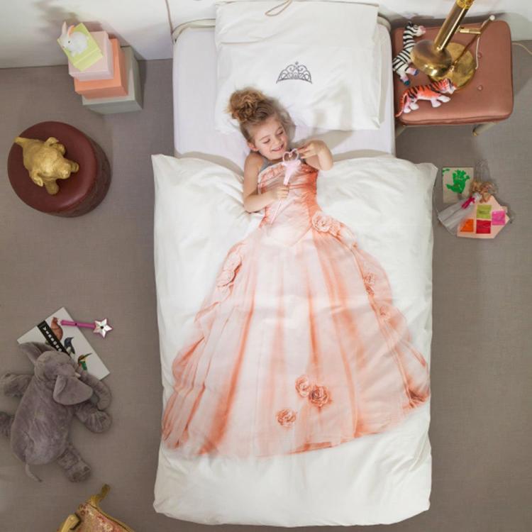 A girl sleeping in a bed with a pink princess dress themed bedsheet