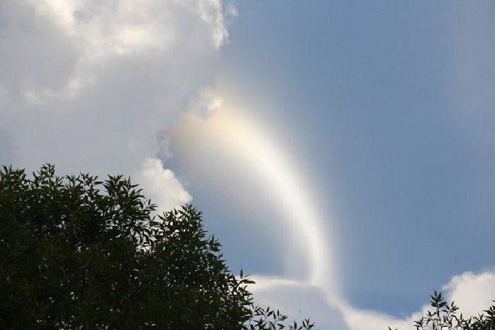 Crown flash phenomenon happening in the clouds