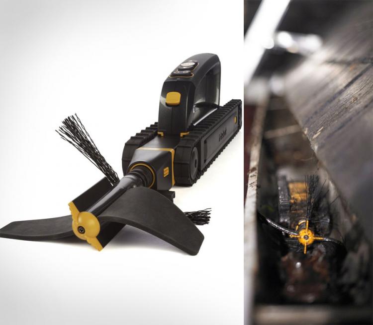 A black gutter cleaning robotic tool with yellow details cleaning the gutter