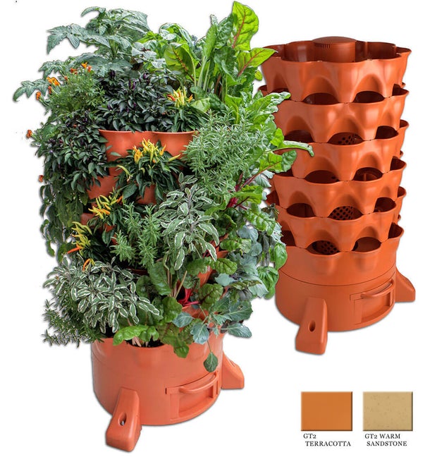 Brown plastic garden tower; one with plants and one without plants 