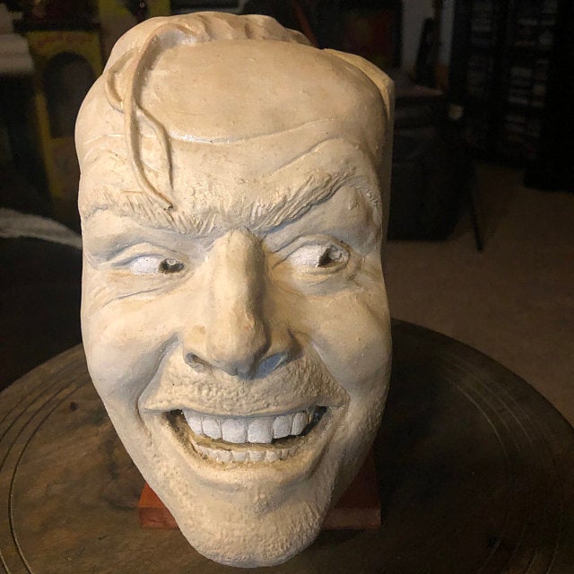 Closed view of white ceramic 'The Shining' Bookend