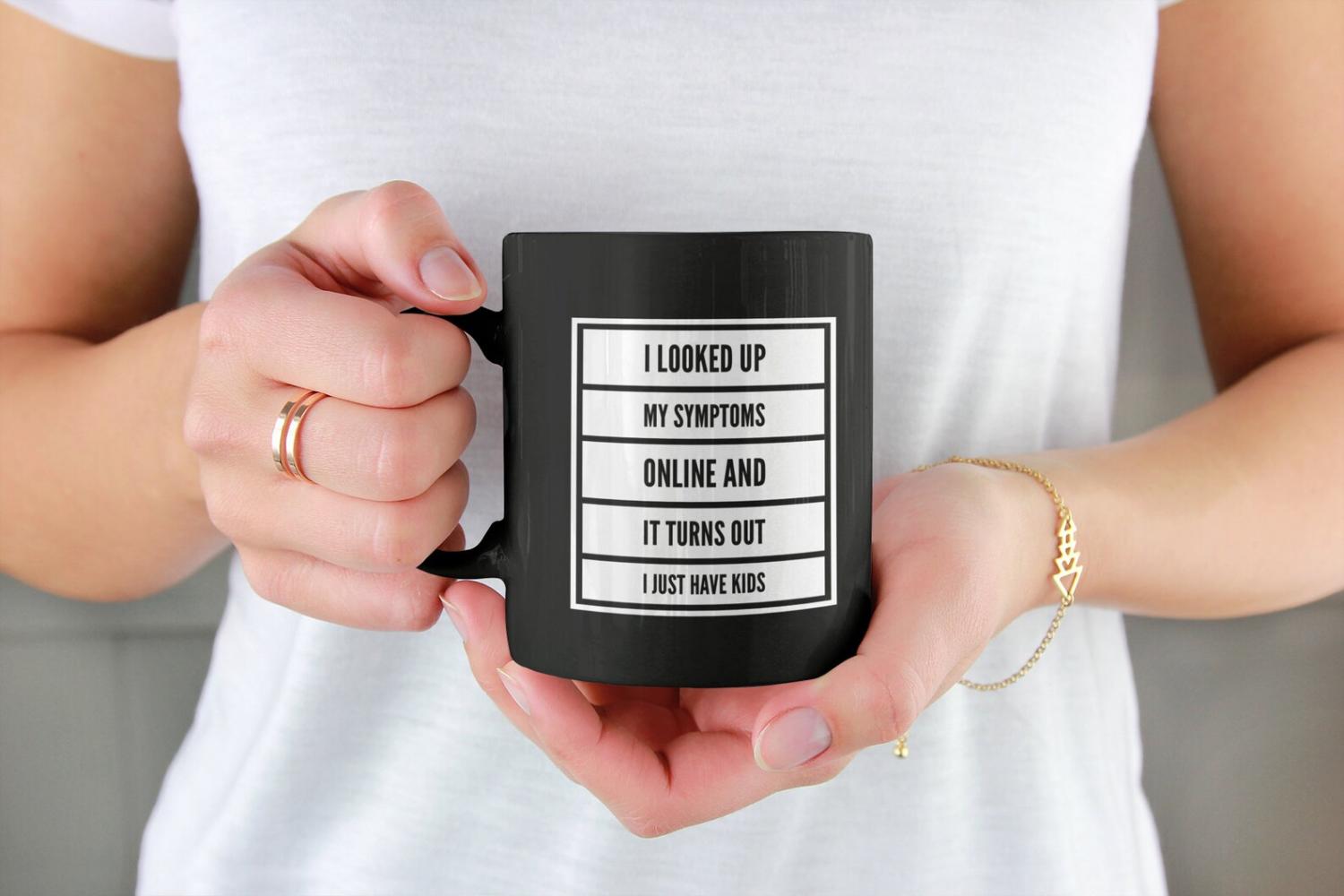 White battery with black colored 'I Looked Up My Symptoms Online And It Turns Out I Just Have Kids' printed on a black mug