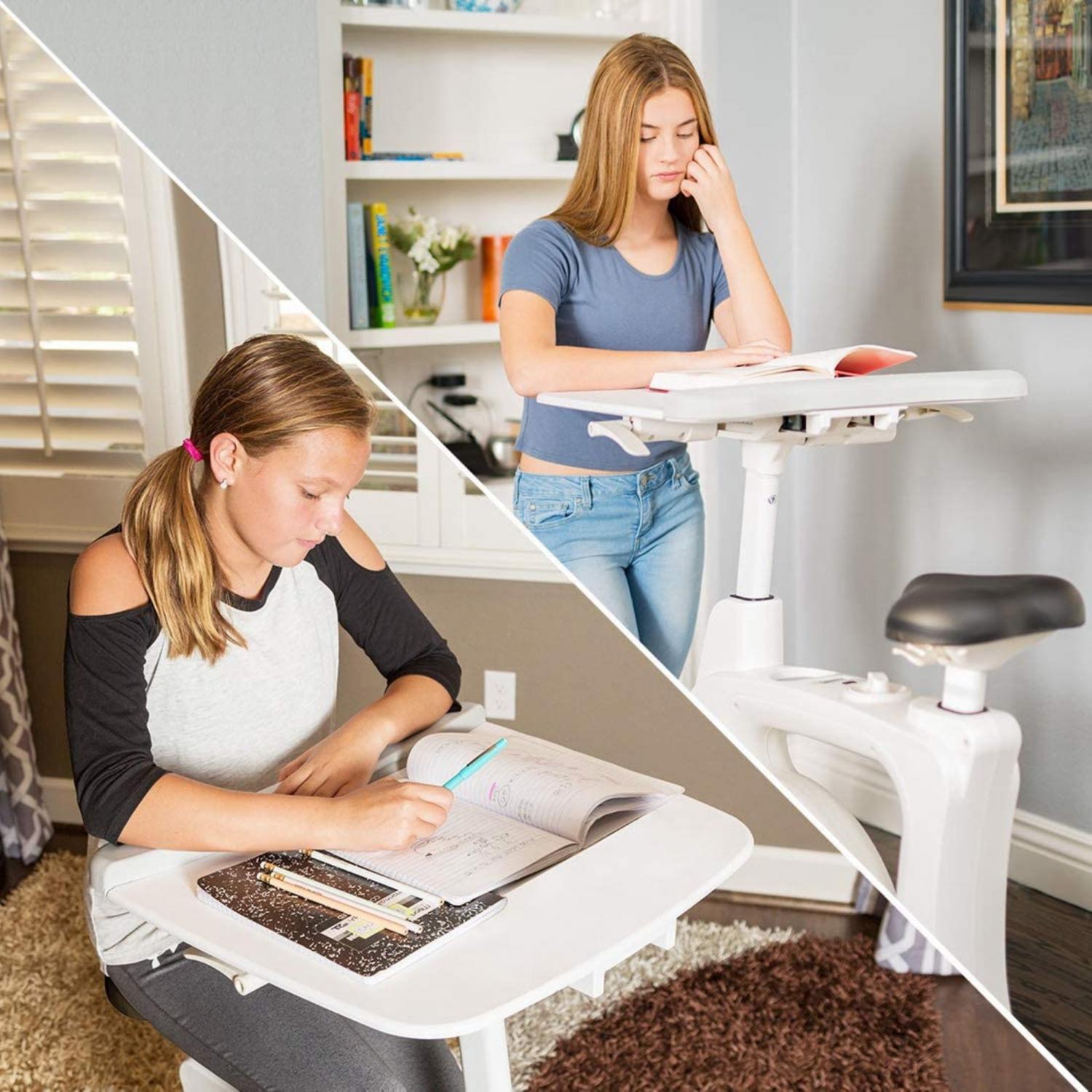 A grey shirt wearing girl sitting on a white Exercise Bike Desk; a black and white shirt wearing girl sitting on a white Exercise Bike Desk