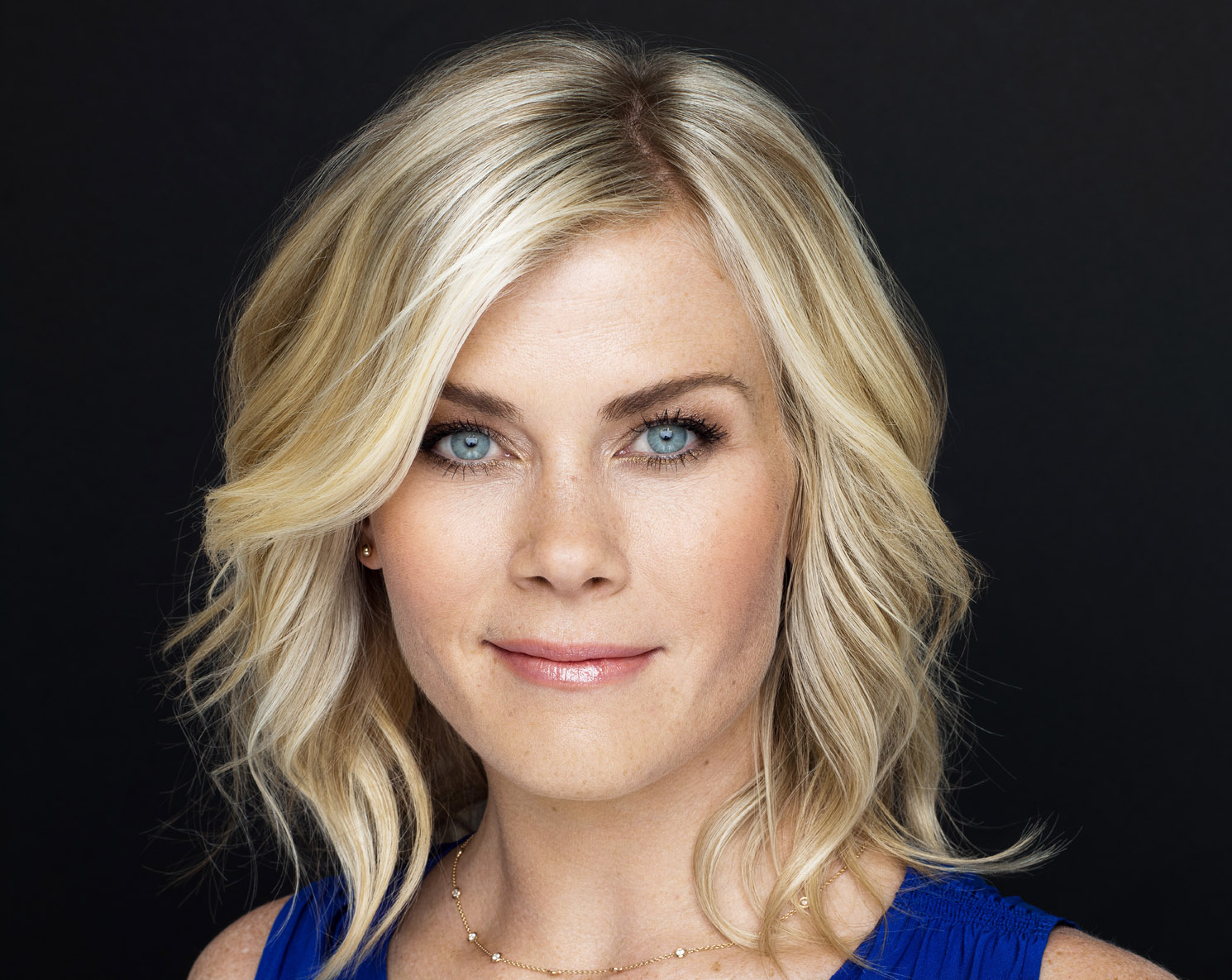 Alison Sweeney with a blonde hair, blue eyes, and blue dress