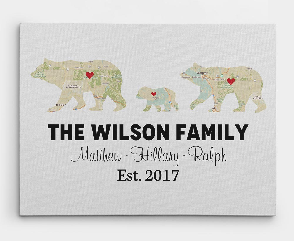 Bear family shaped maps on a white-grey background on a white wall