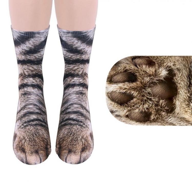 A girl wearing brown and black colored cat feet socks