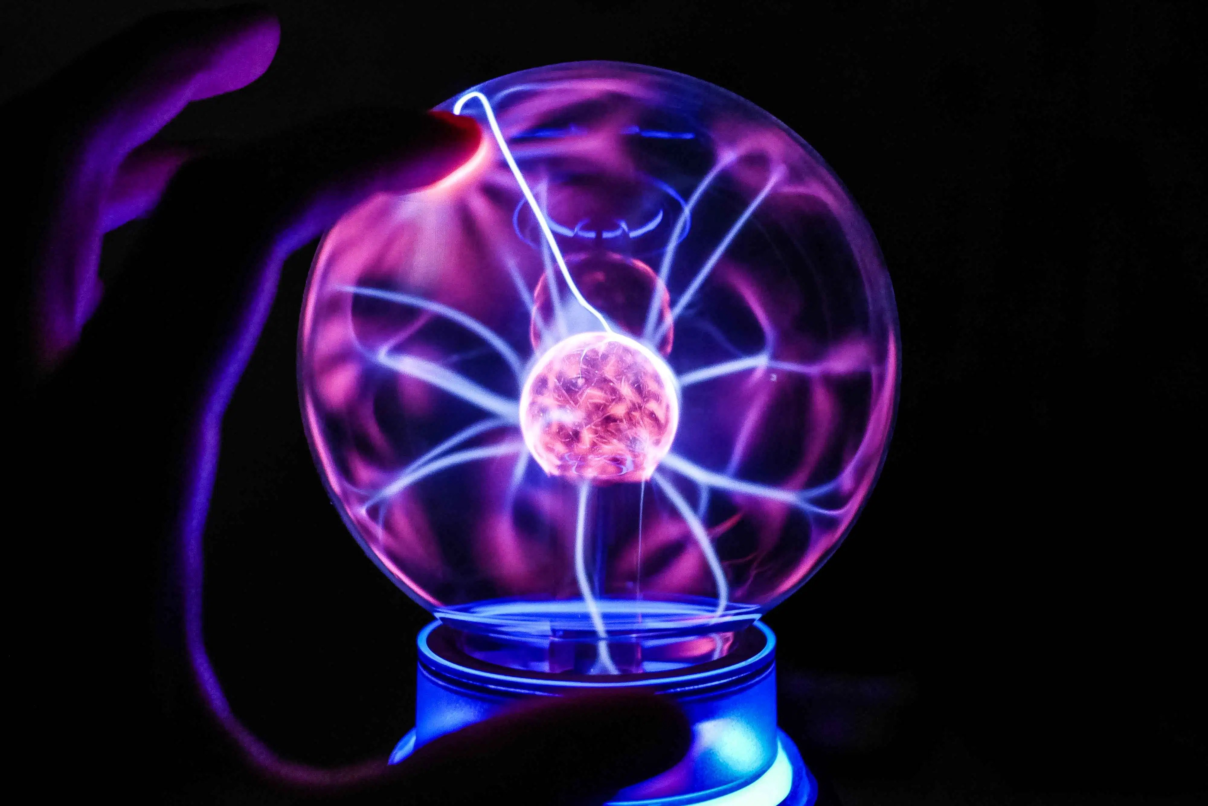 Blue and pink plasma in a glass plasma globe