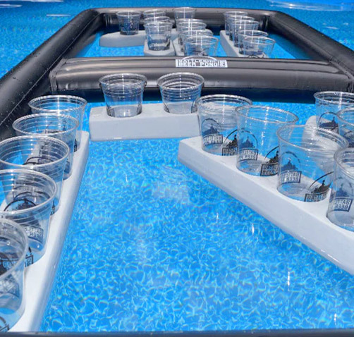 A bunch of glasses on black and white cup holder float in swimming pool