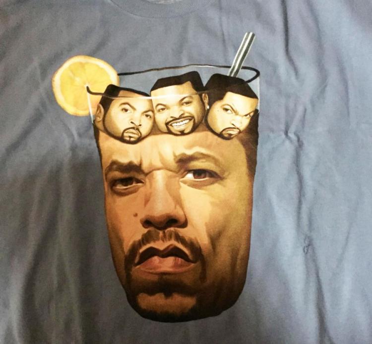 A printed face in a glass on a grey t-shirt