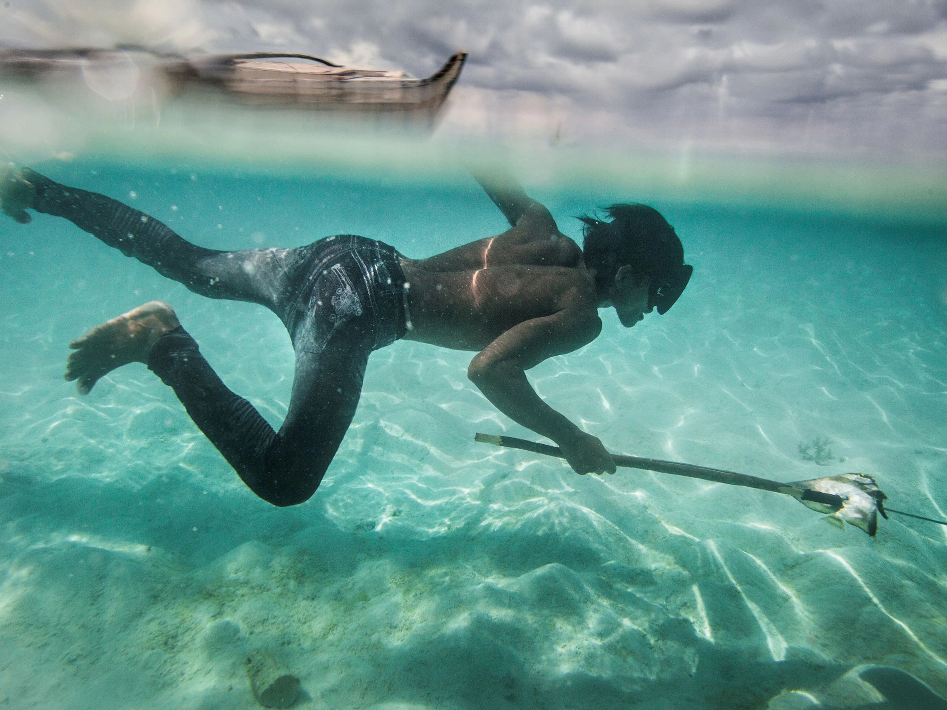 Bajau fisherman diving in the sea