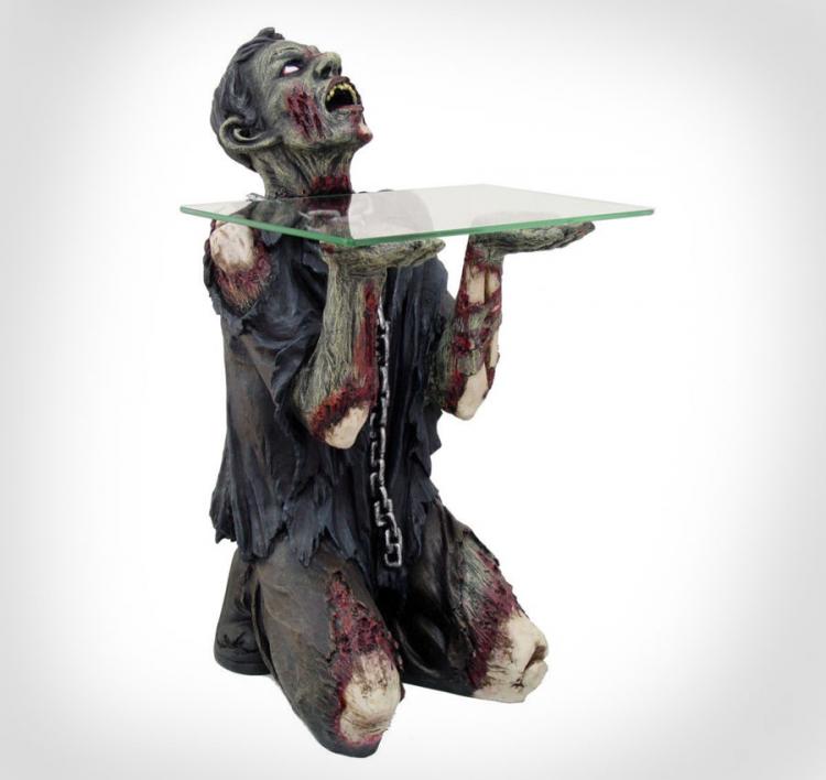 A black ripped dress filled with blood and dust wearing zombie holding a glass slab