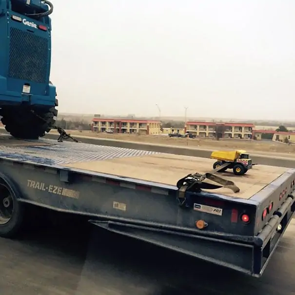 Heavy loaded truck with a small one