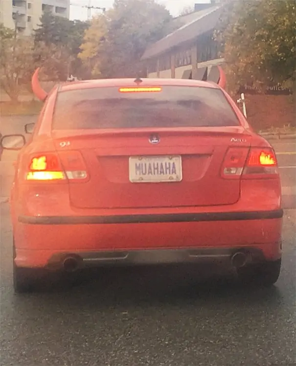 Red car license plate spelling the word muahaha