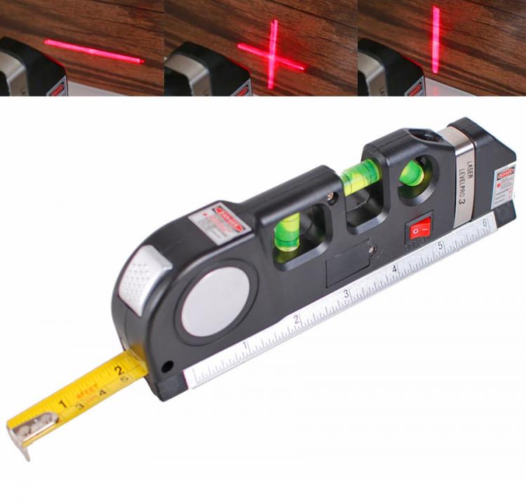 Black and grey colored laser tool with measuring tape on it
