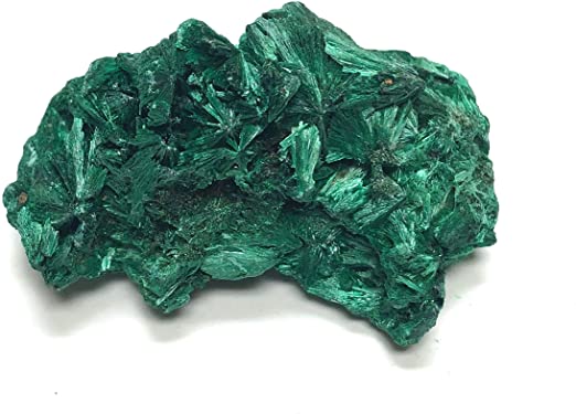 Green and light green colored needle textured specimen of raw Malachite Stone on a white surface
