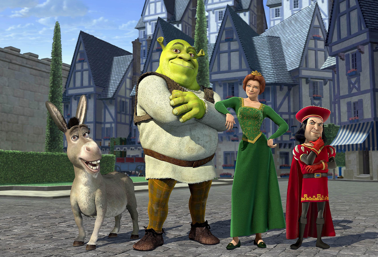 Shrek, a donkey, a red dress wearing man, and Fiona wearing green dress standing on the road