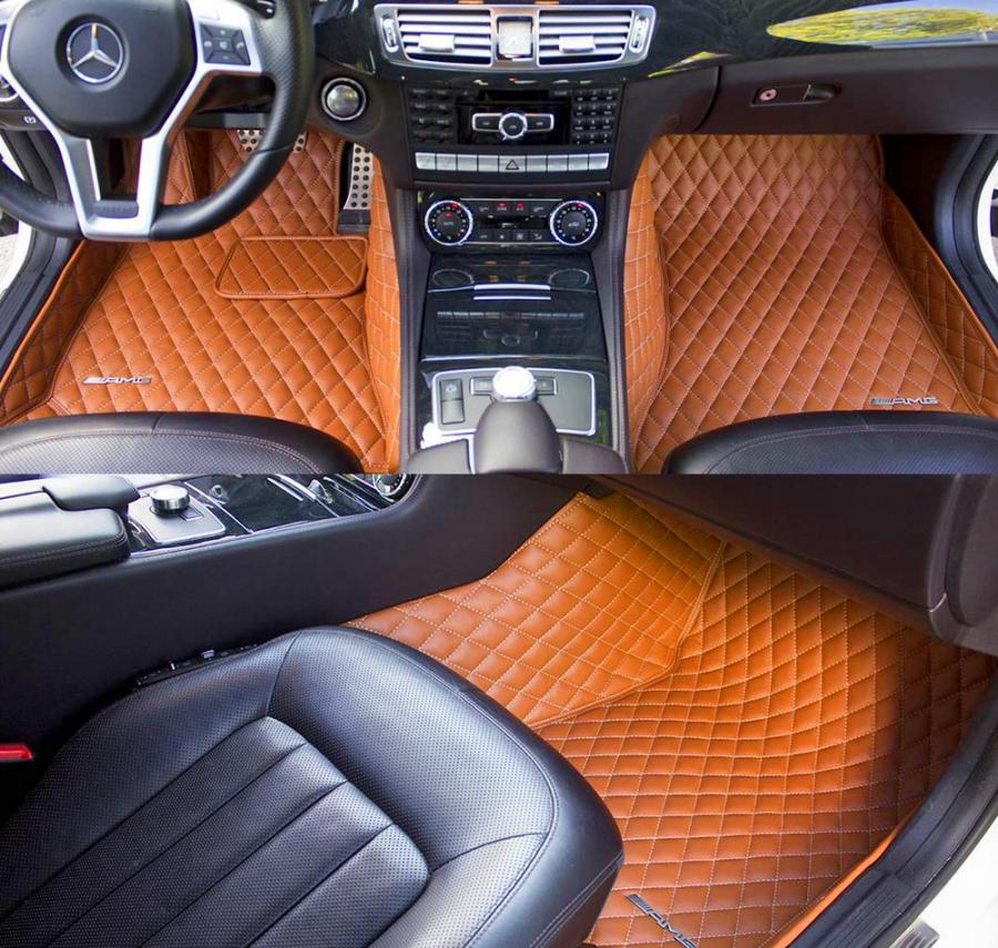 Black and orange-brown colored leather car seats of a luxury car