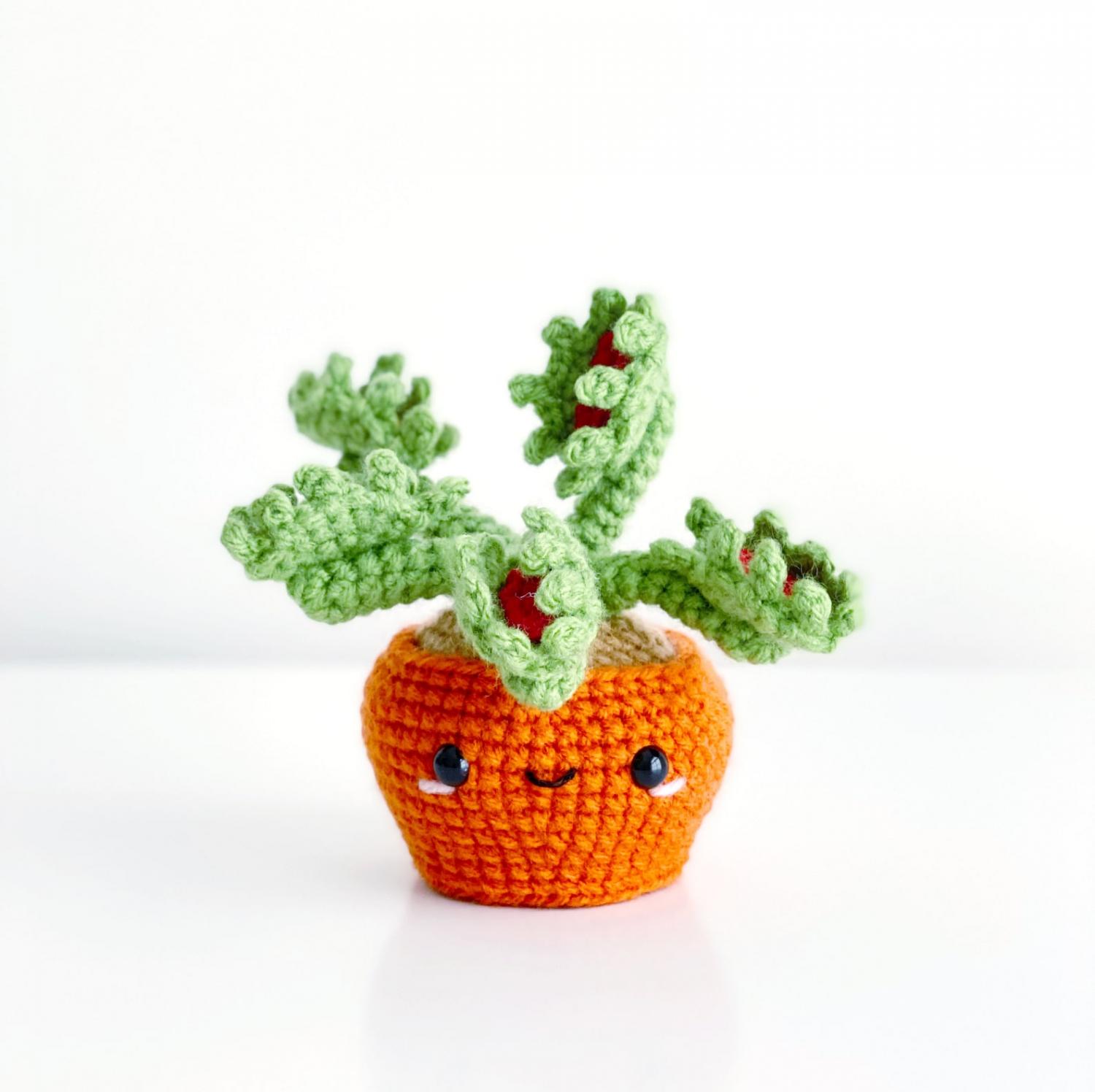 Green and red colored venus flytrap Adorable Crochet House Plant in an orange crochet pot