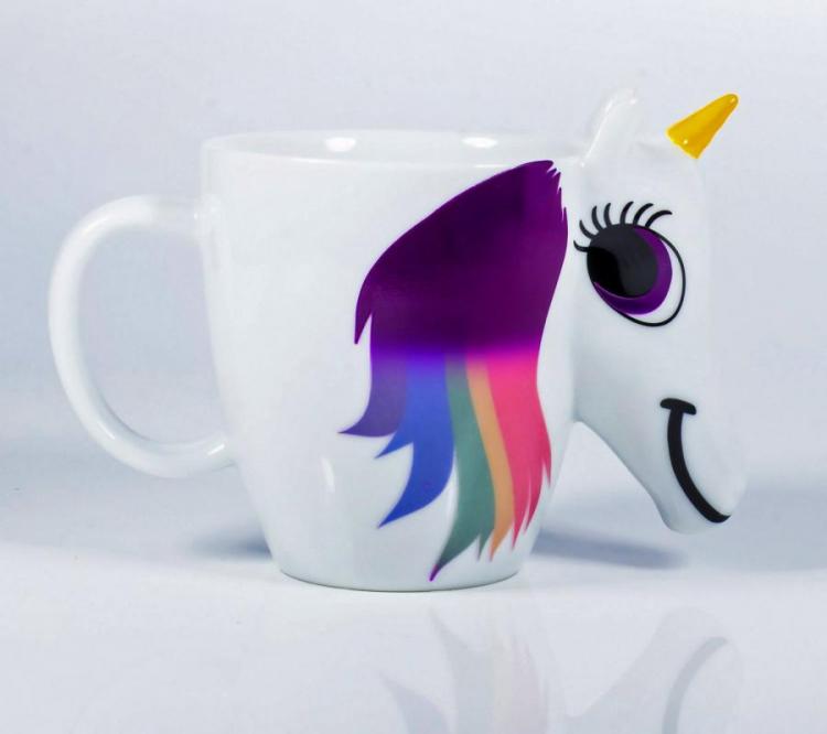 Golden horned and rainbow-hair unicorn mug on a white surface