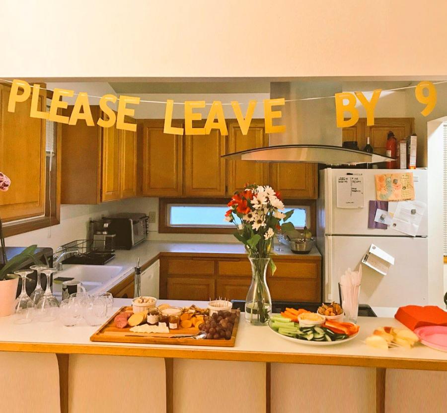Please leave by nine party band hung in the kitchen with some fruits, salad, glasses placed on the white-skin kitchen top