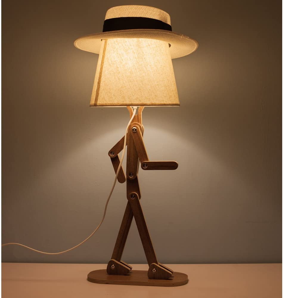 Brown wooden dancing Man Adjustable Wooden Lamp on a brown wooden table