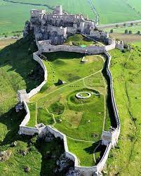 An aerial drone shot of white-colored gigantic Spiš Castle Slovakia