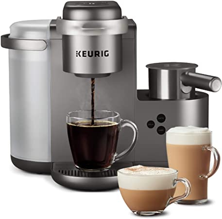 Keurig Coffee Maker with 3  mugs full of different kinds of coffee