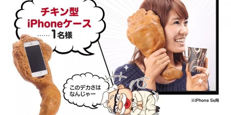 A blue shirt wearing girl holding a gigantic brown fried chicken phone case