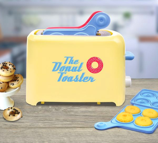 Yellow colored donut toaster with donutsand  blue and pink donut trays on a kitchen top