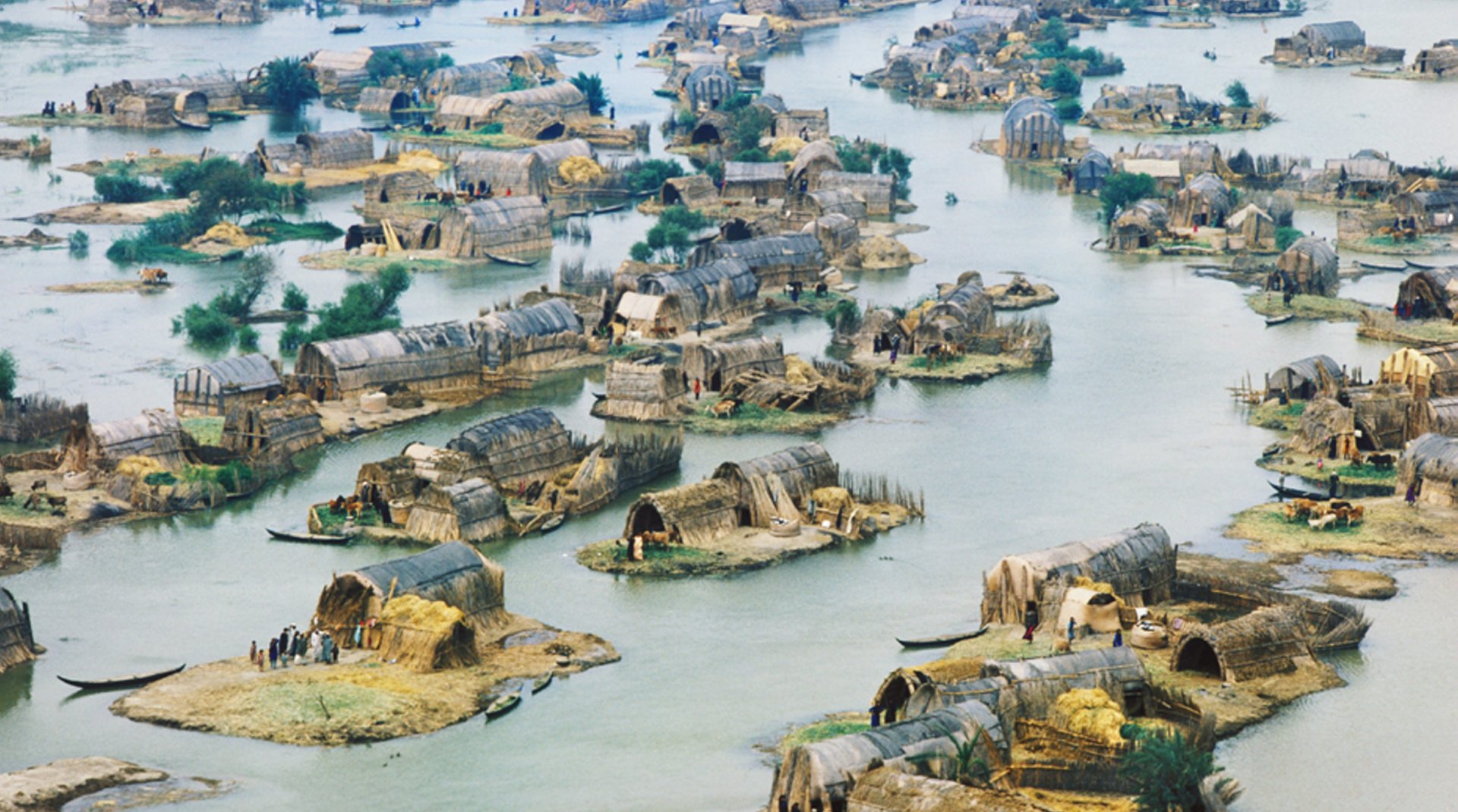 A drone shot of houses in the Mesopotamian Marshes Iraq