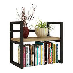 Mini bookcase with books, plant pot and a vase