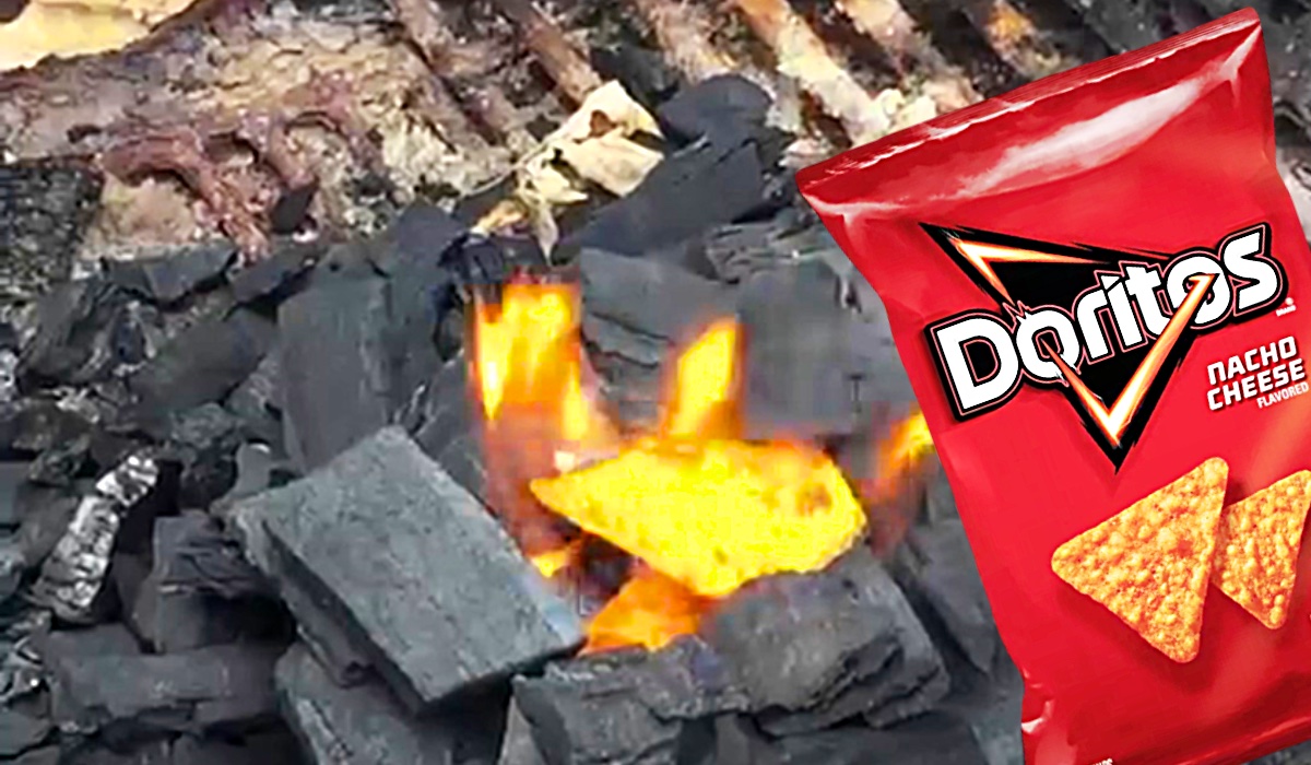 Doritos are burning with coal with a red pack of Doritos in the side