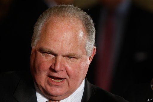 Rush Limbaugh in a suit with his mouth open