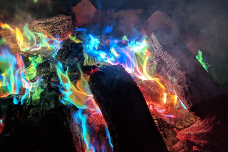 Multicolored mystical fire around the wood pieces