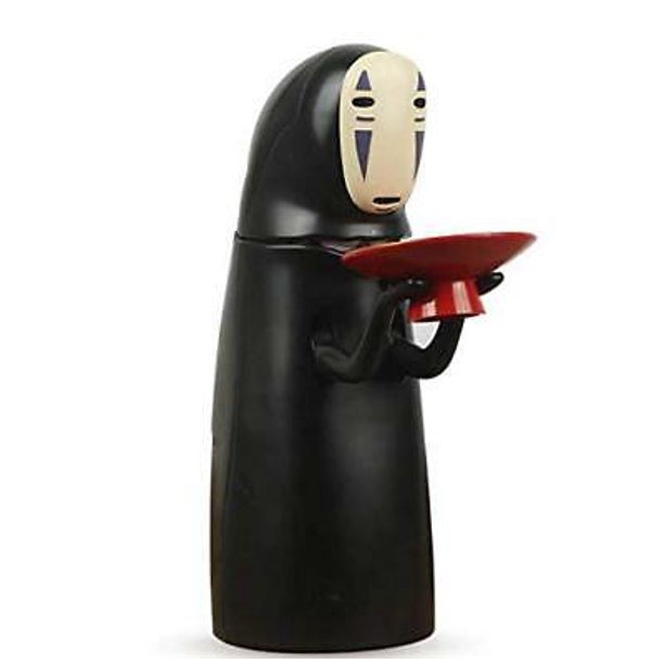 Black gown wearing nun holding a red plate piggy bank