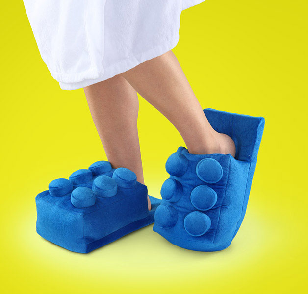 A girl wearing a giant blue block slippers